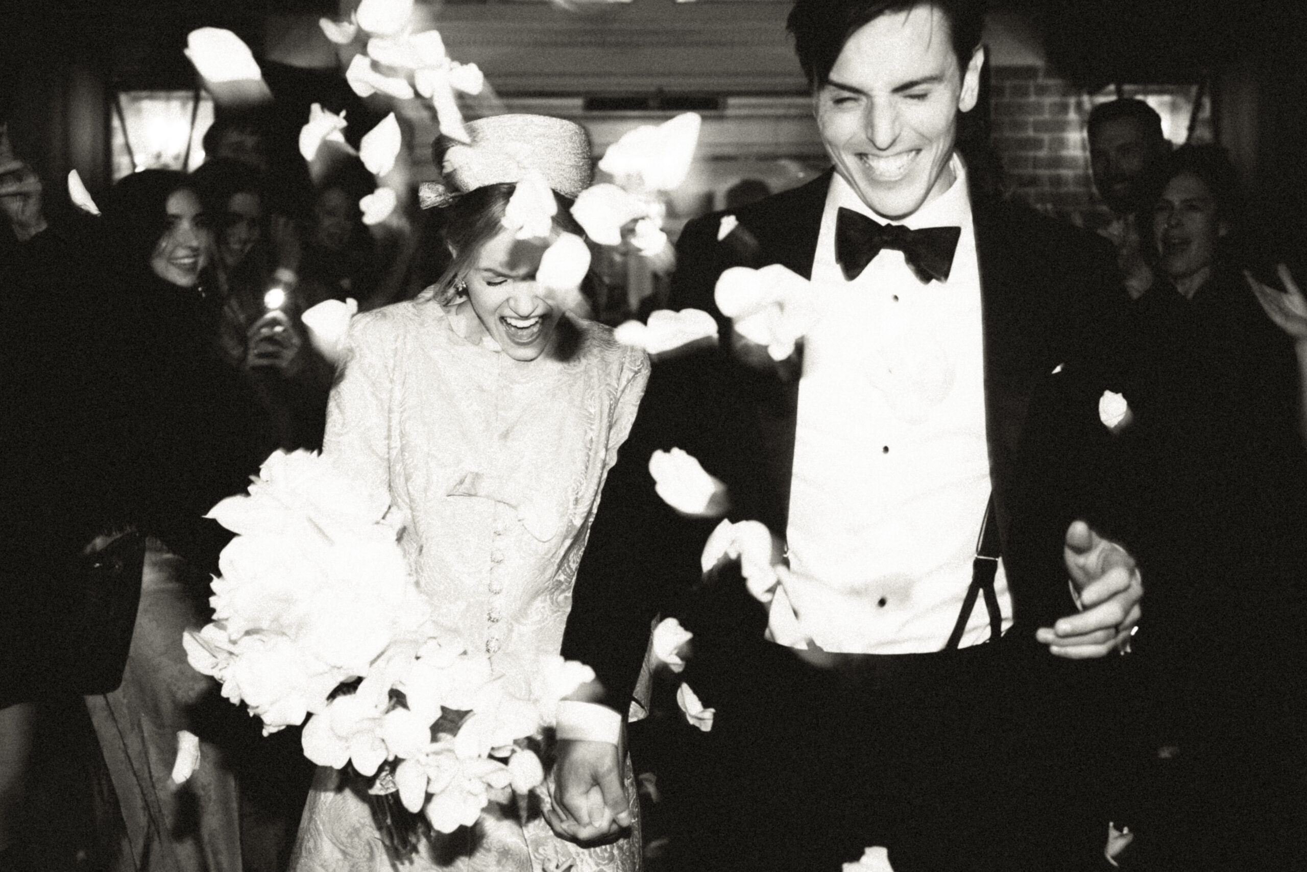 Bride and groom exit their wedding with a petal toss, Vintage New York City Wedding Photography