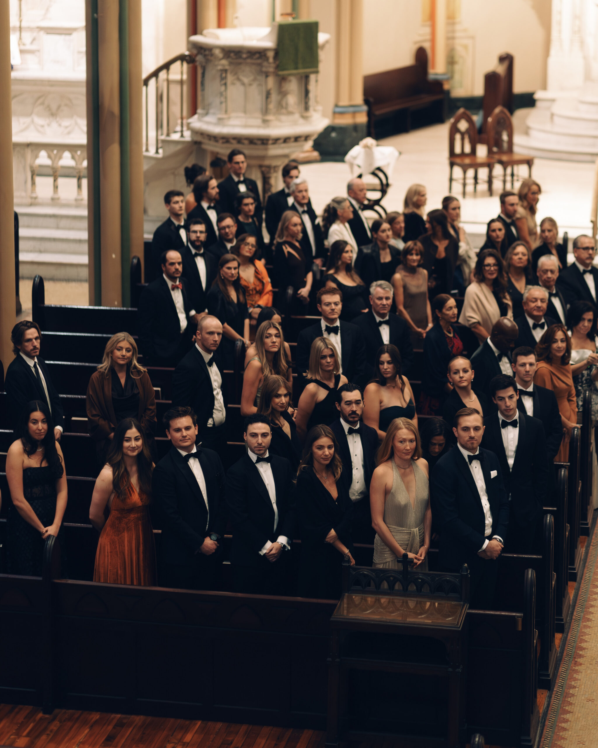 guests rise for the bride