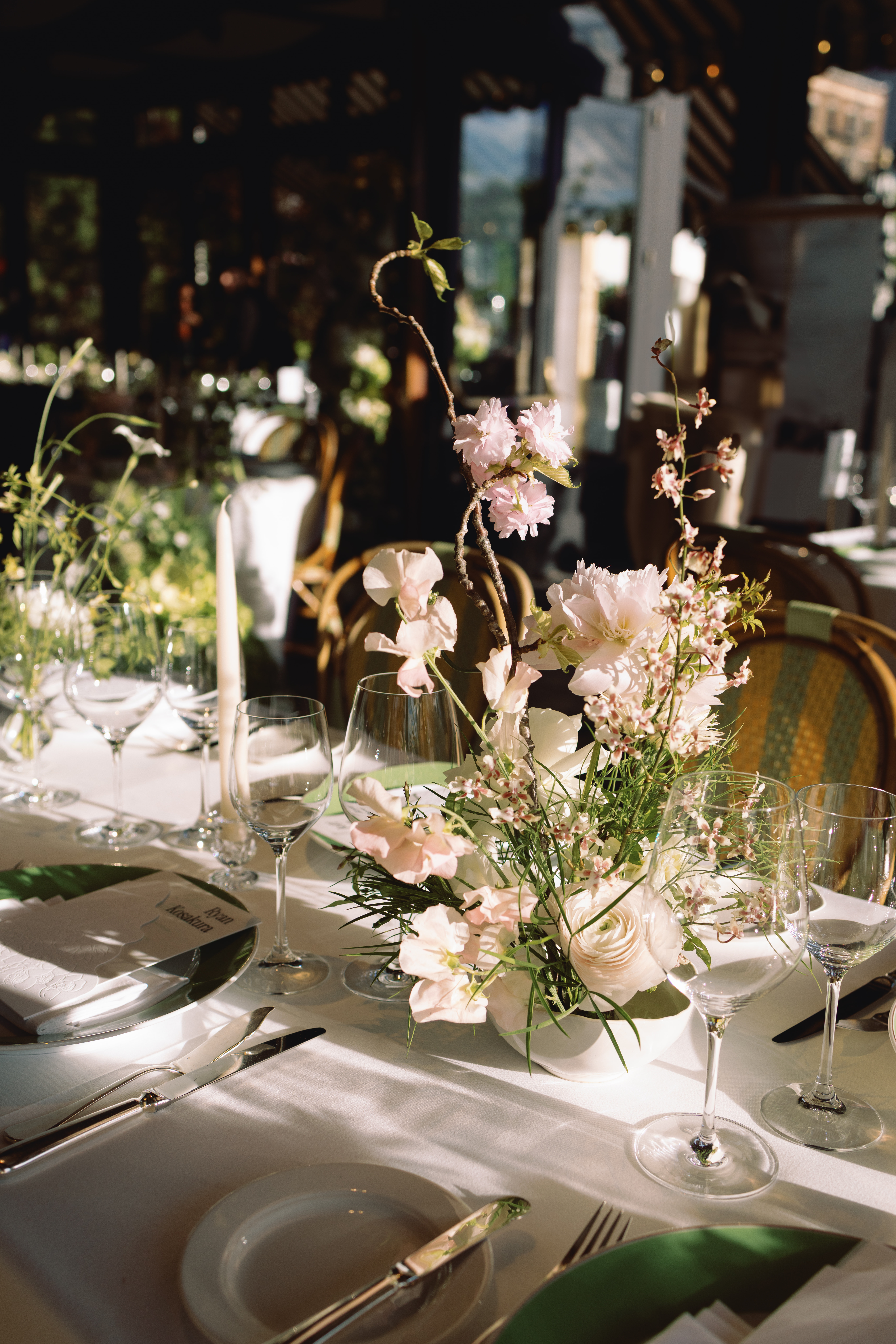 Intimate reception dinner with candlelight and floral arrangements