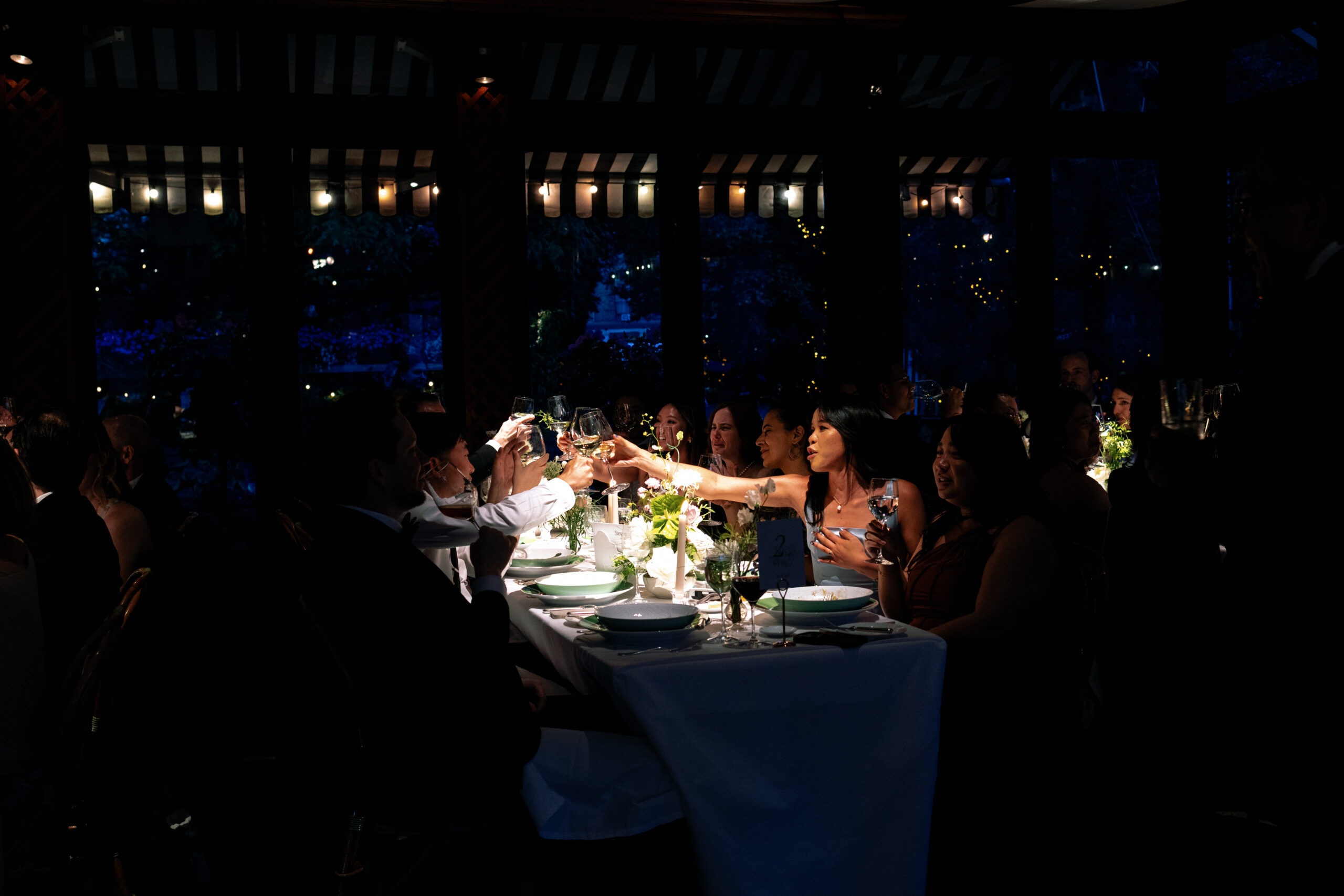 Intimate reception dinner with candlelight and floral arrangements