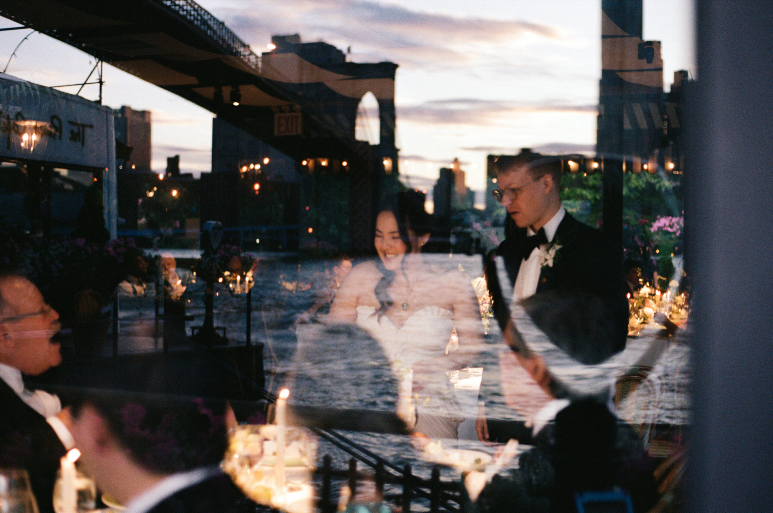 The River Café in Brooklyn candid reception moments with Manhattan skyline views