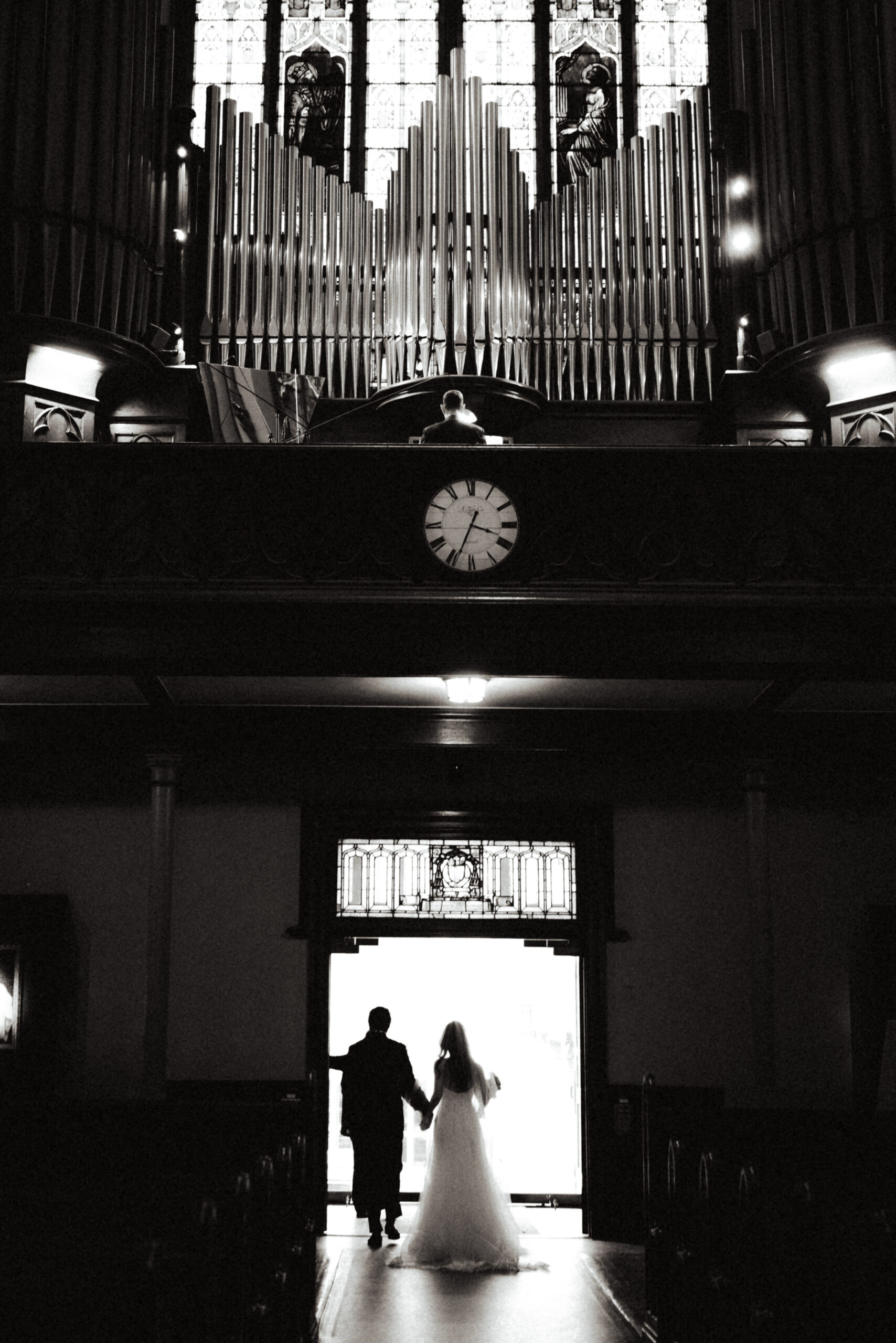 bride and groom leave the church in editorial and artful fashion