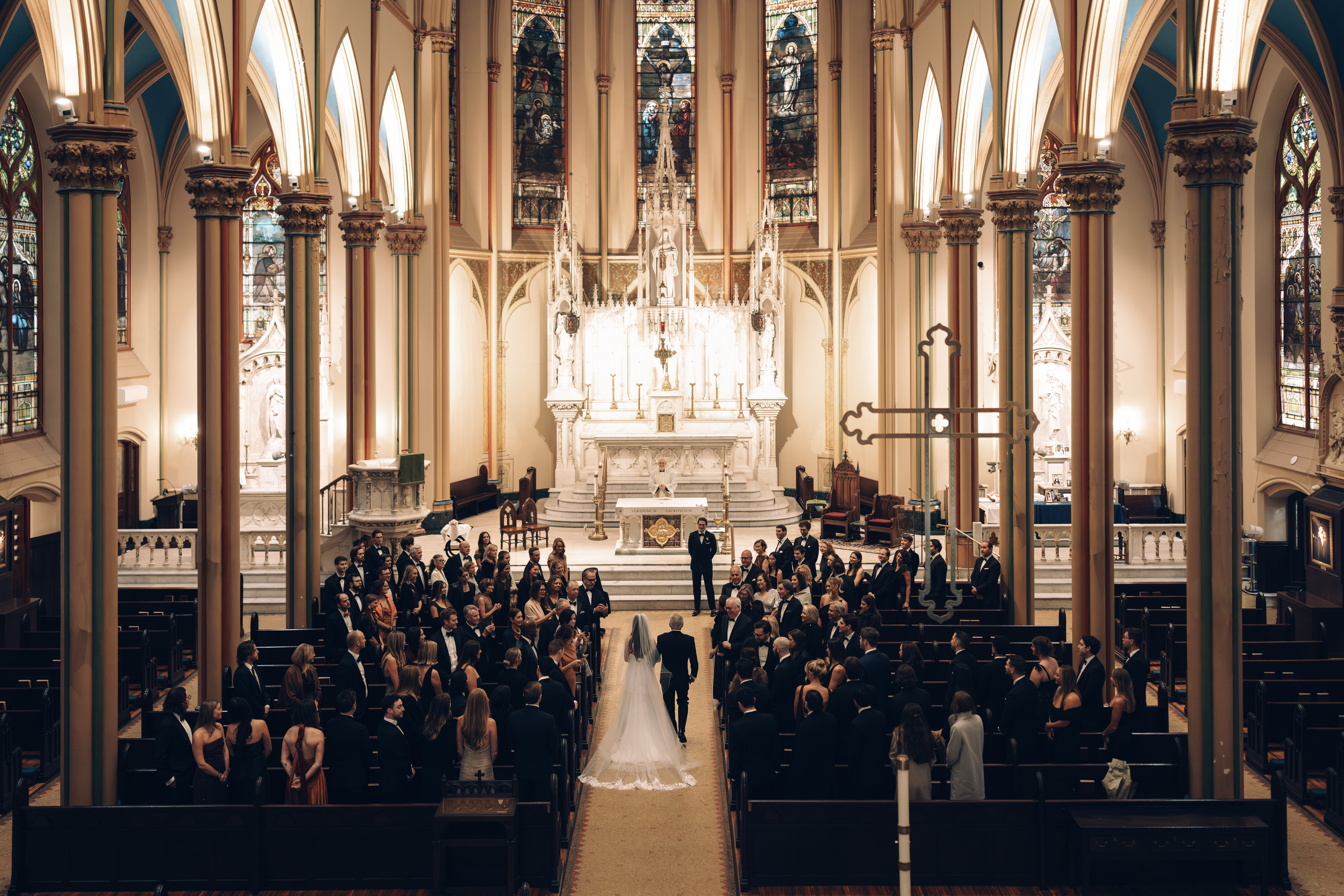 bride entering into the church with father