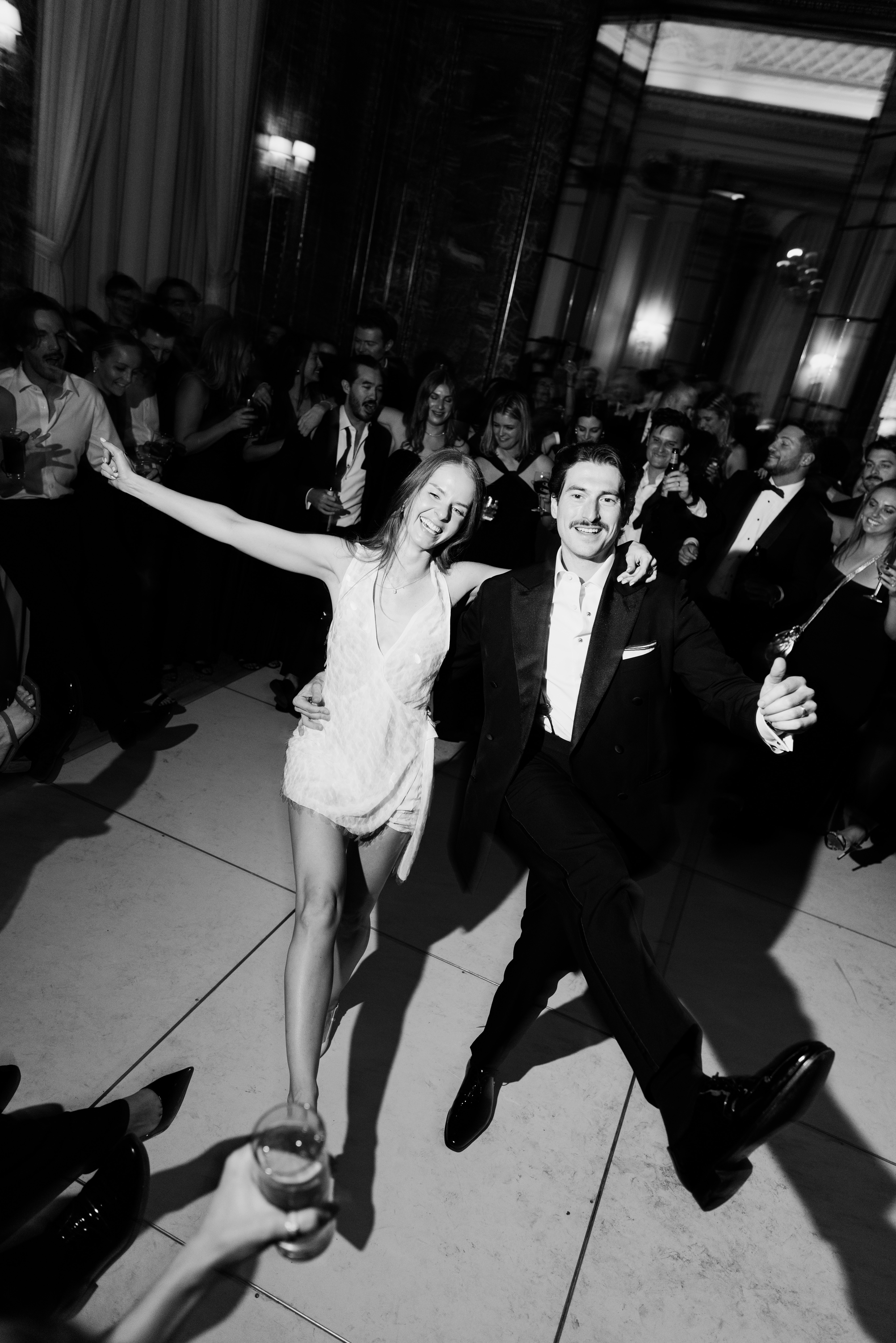Exterior of Burden Kahn Mansion showcasing historic Gilded Age architecture as bride and groom exit