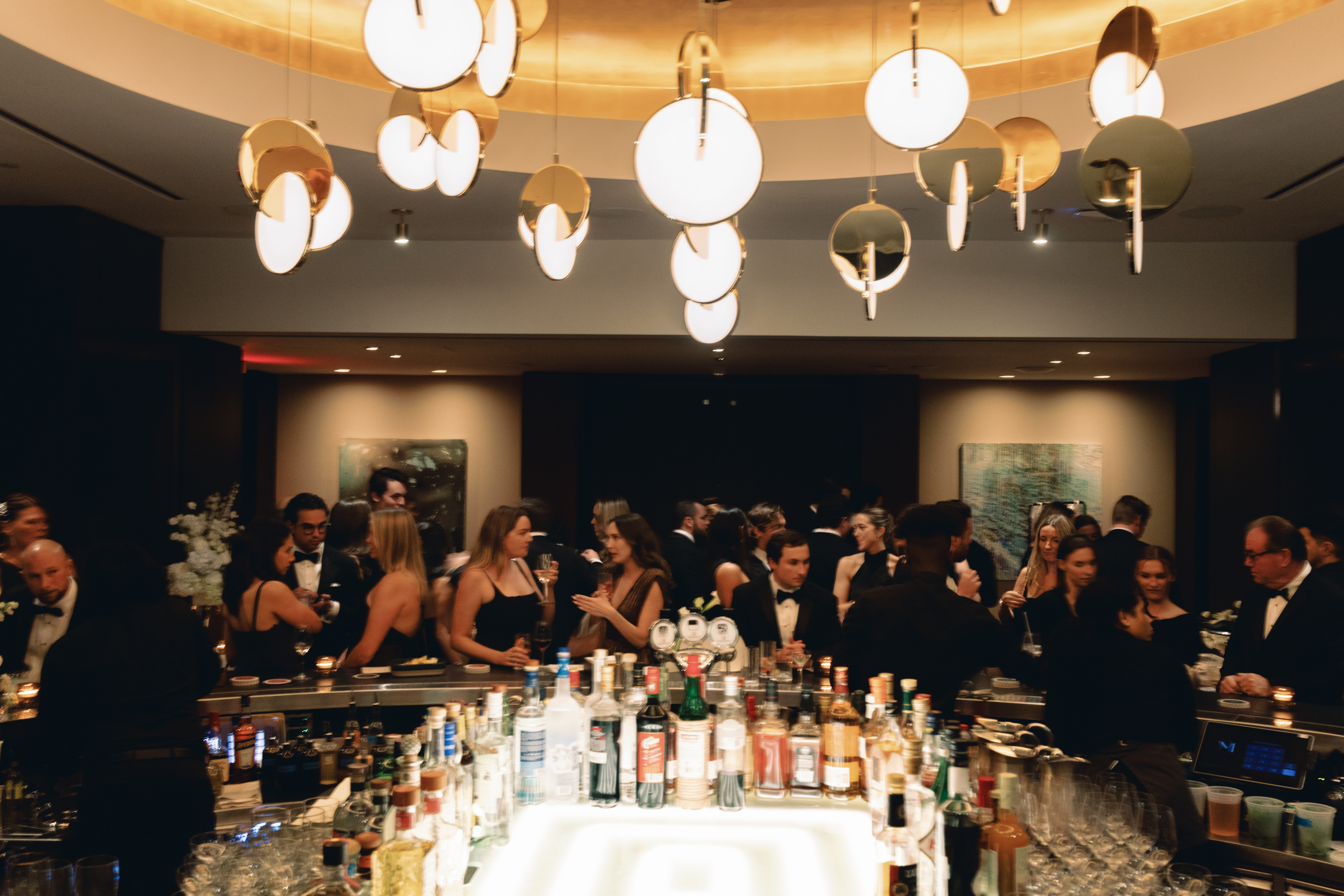 Candlelit reception space at Manhatta with skyline glowing at night