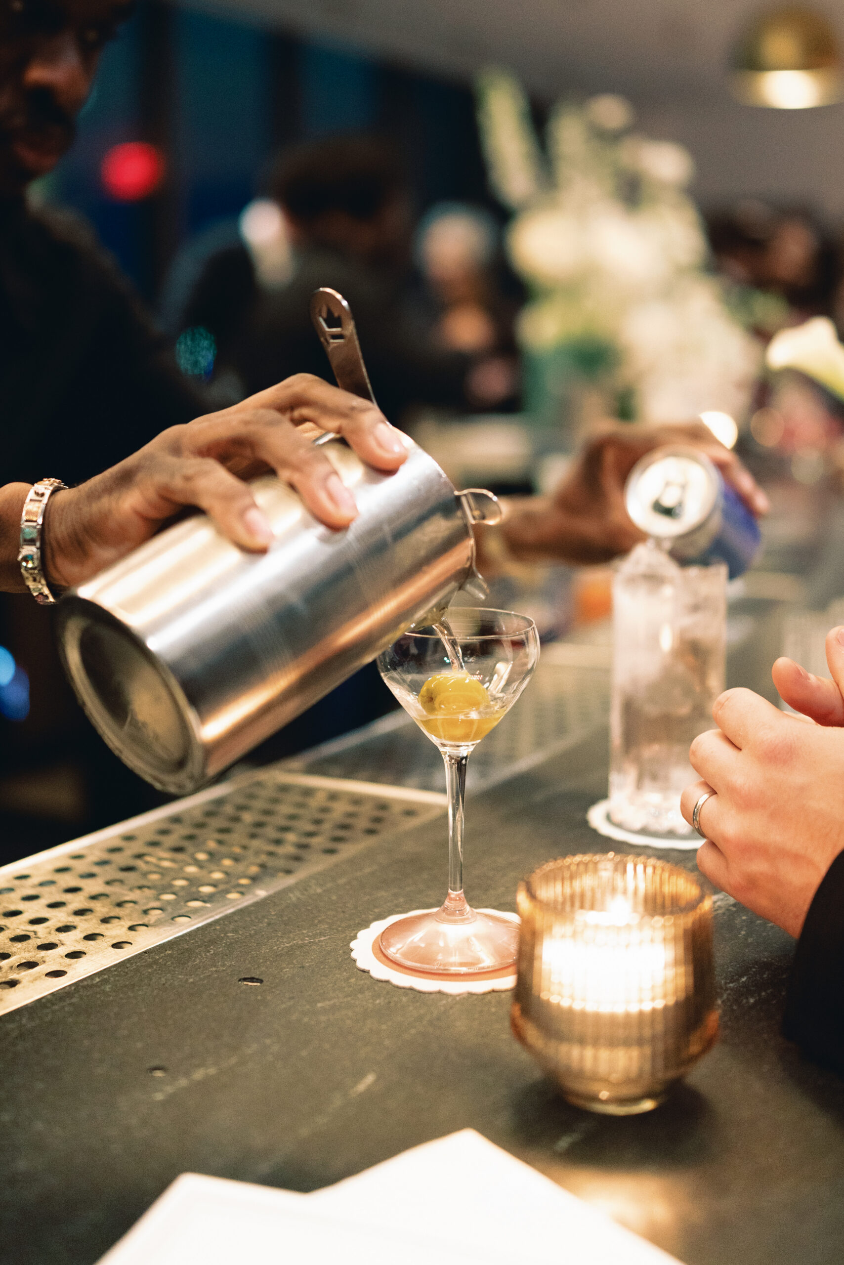 Candlelit reception space at Manhatta with skyline glowing at night