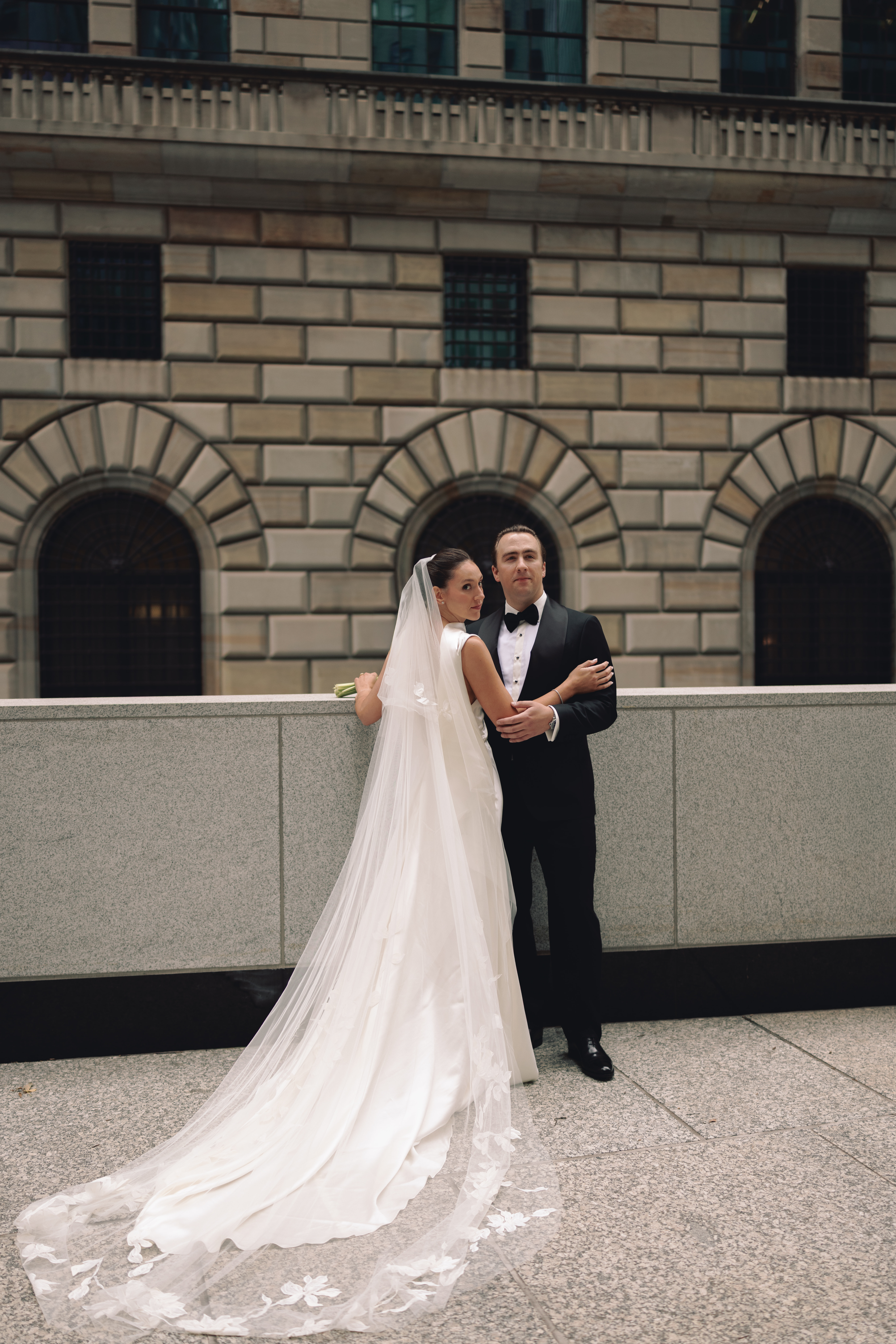 Newlyweds walking through Manhattan streets for editorial wedding portraits