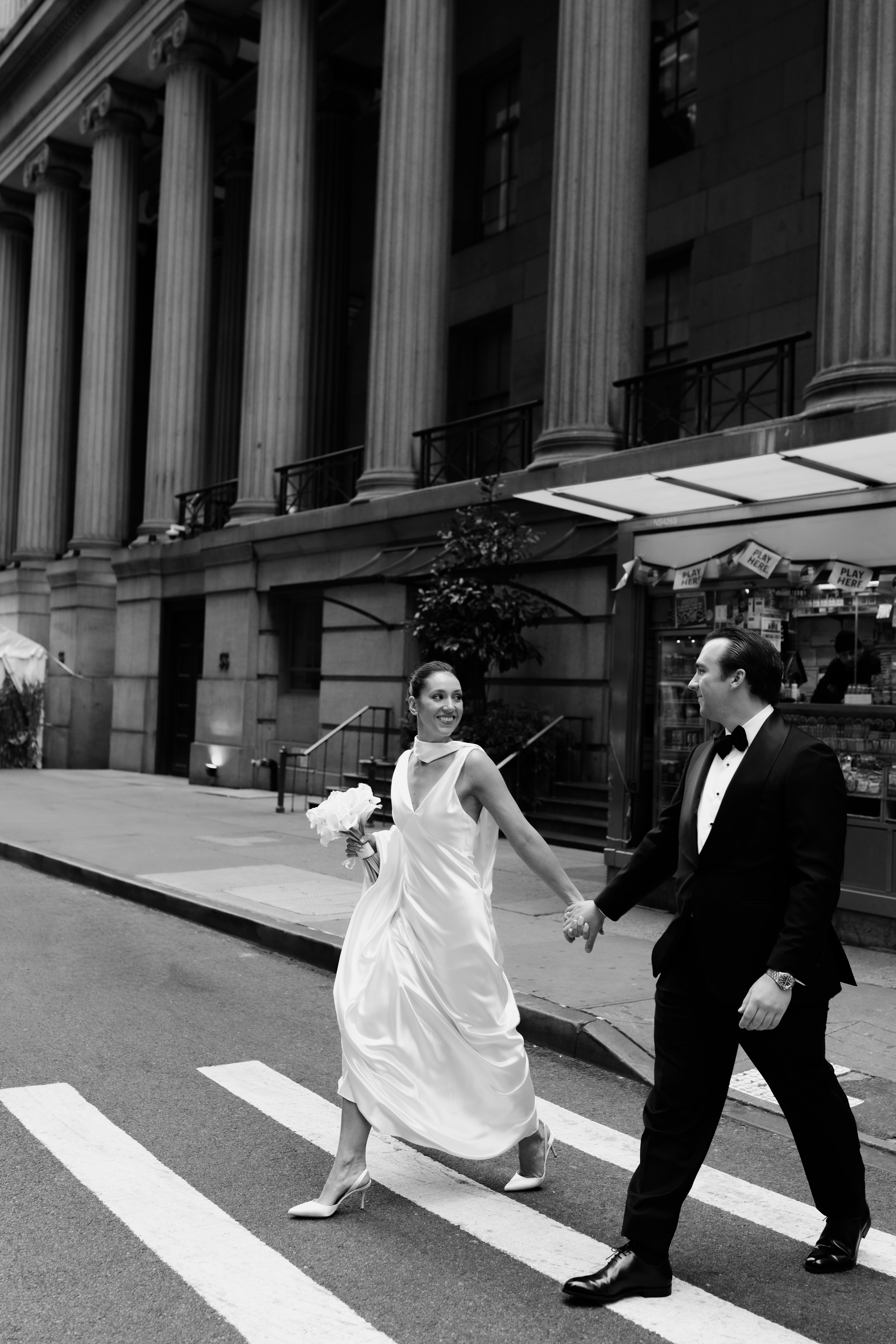 Newlyweds walking through Manhattan streets for editorial wedding portraits
