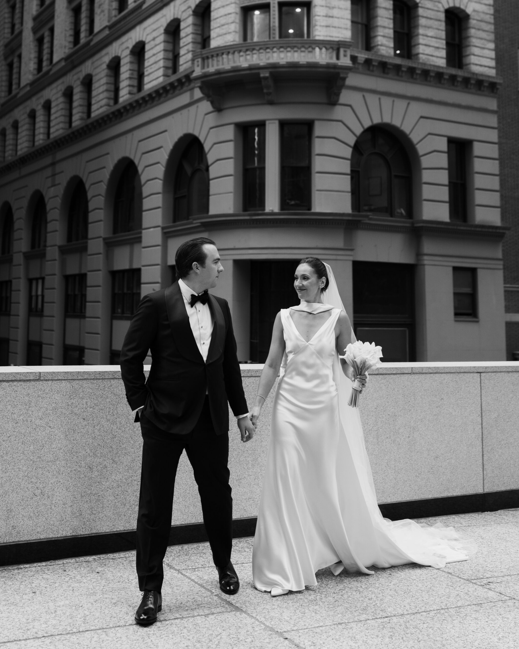 Newlyweds walking through Manhattan streets for editorial wedding portraits