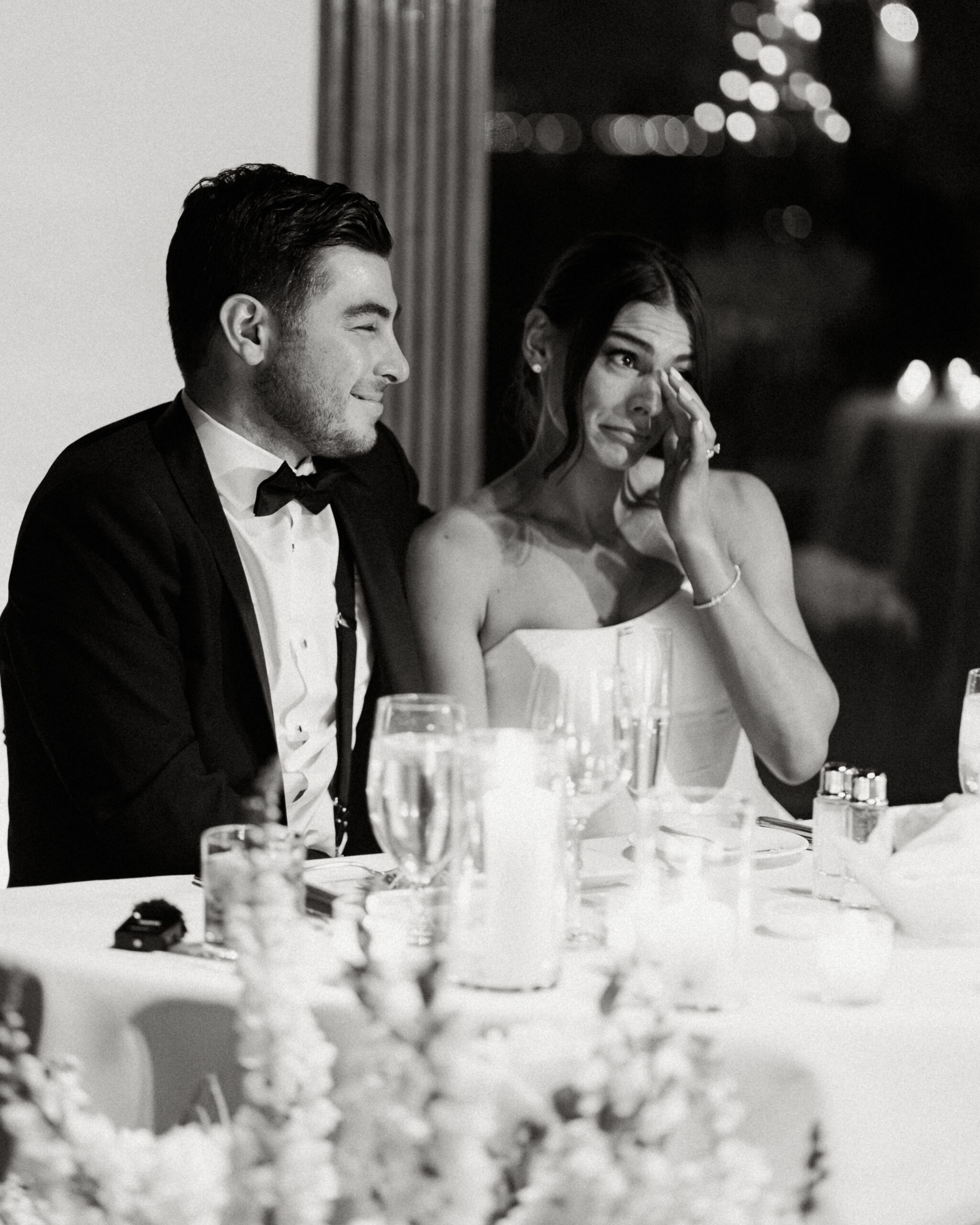 Candlelit reception tables glowing with romantic ambiance