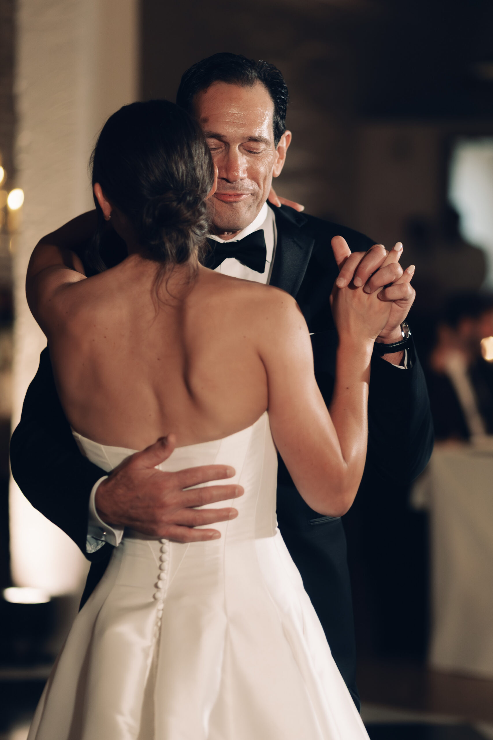Candlelit reception tables glowing with romantic ambiance