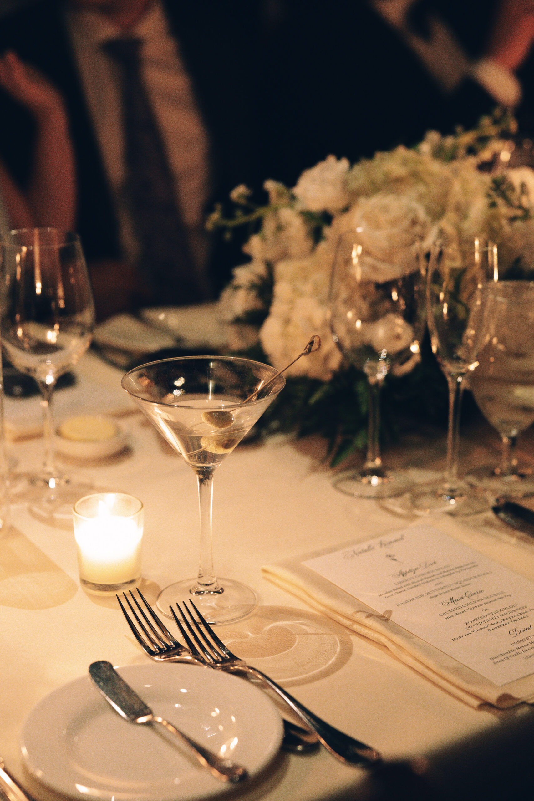 Candlelit reception tables glowing with romantic ambiance