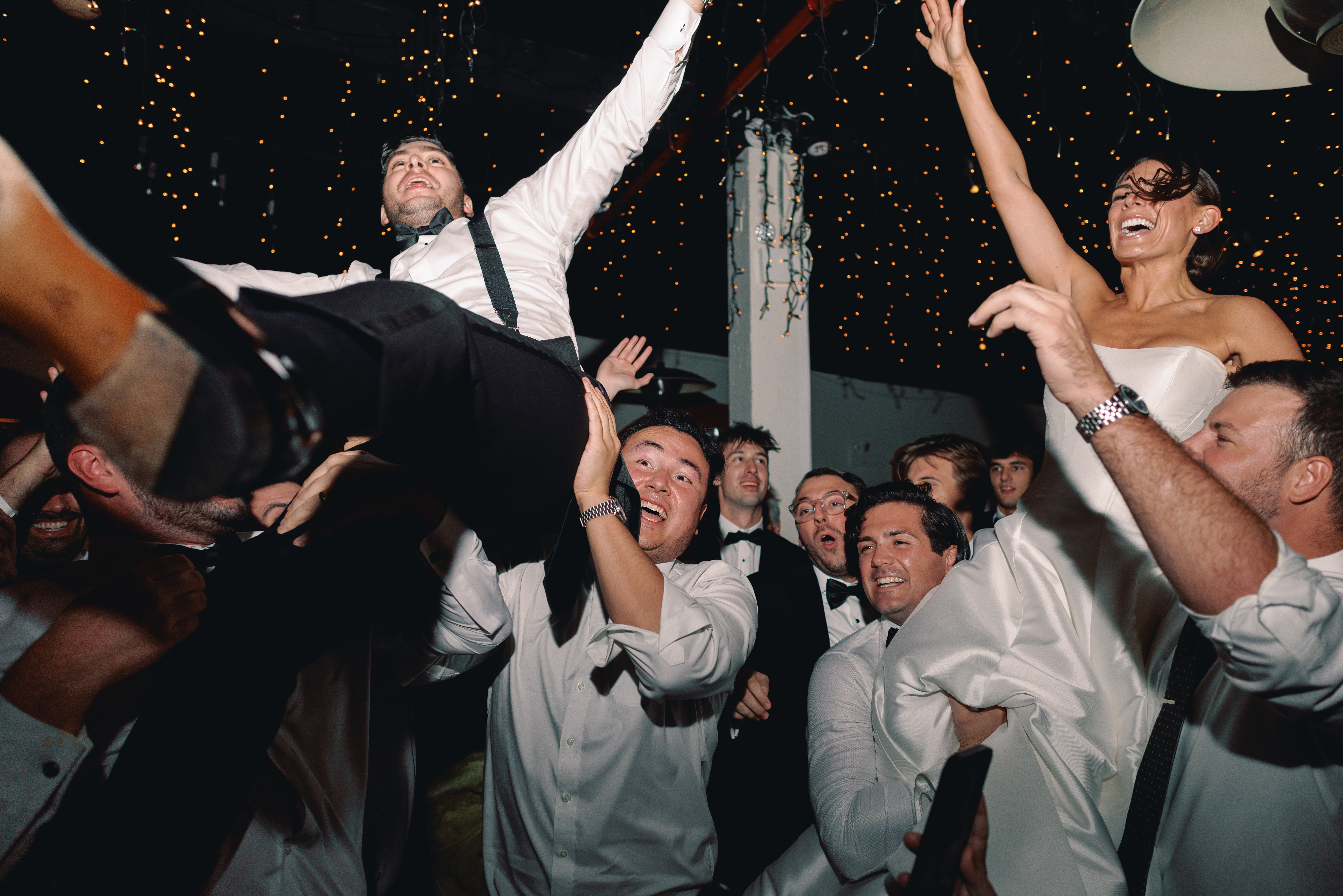 Dance floor moment with guests mid-spin under warm lighting