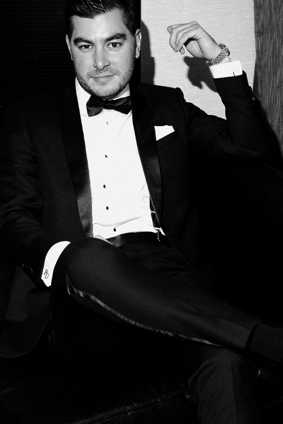 Groom in suit from Mr. Robbie’s Suits in a classic black-and-white portrait