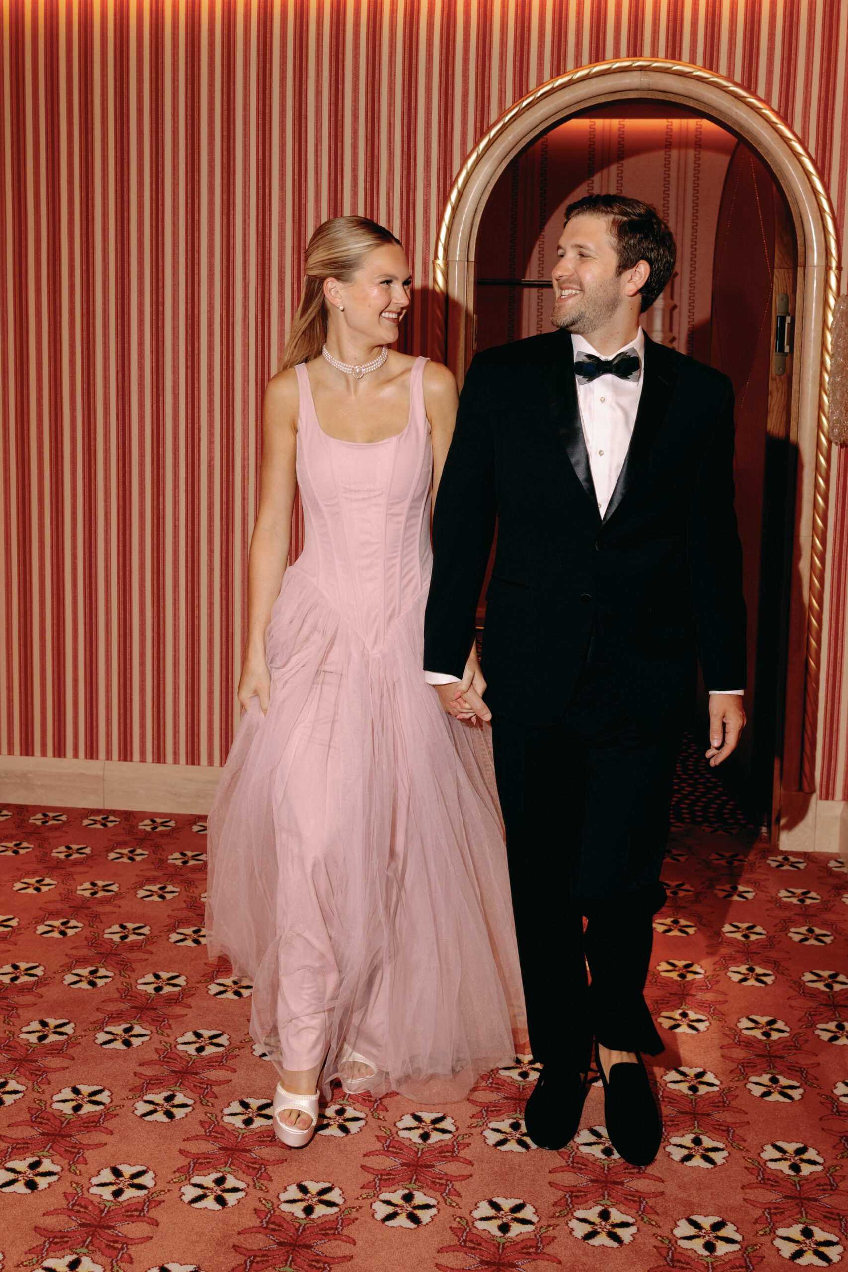 Bride-to-be in romantic engagement outfit inspired by La Vie en Rose theme