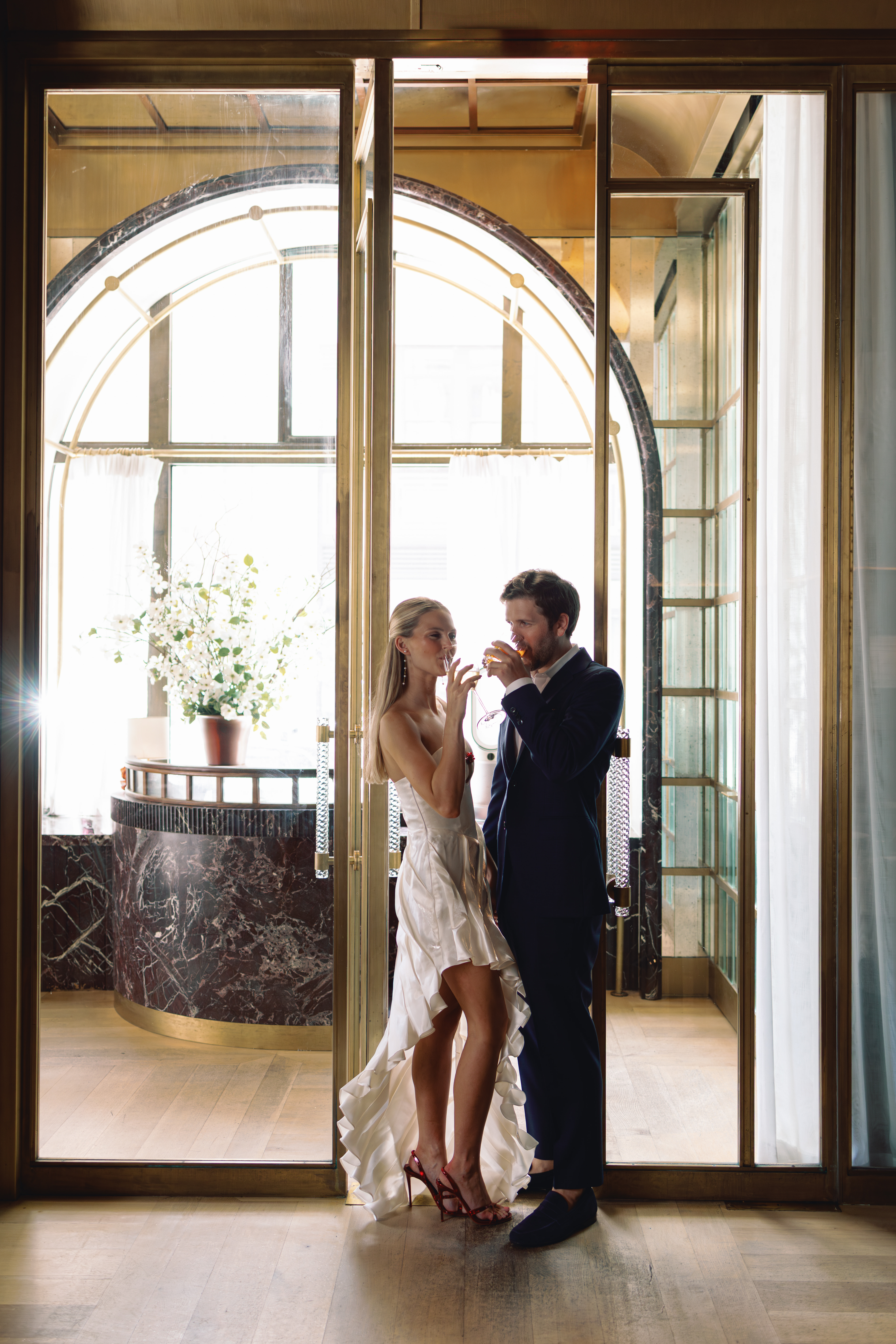 engaged couple with drinks in hand in manhattan